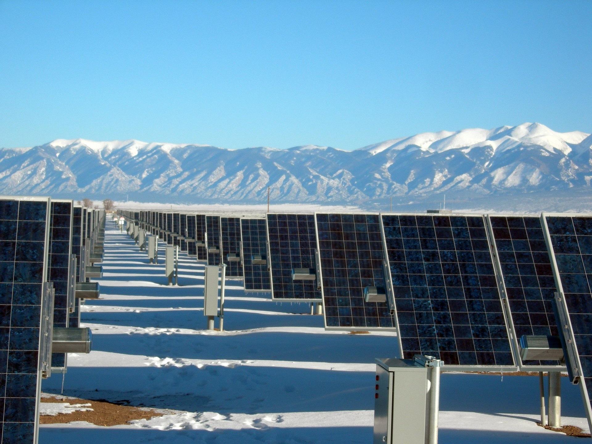 Snowfall covers a solar form in the mountains